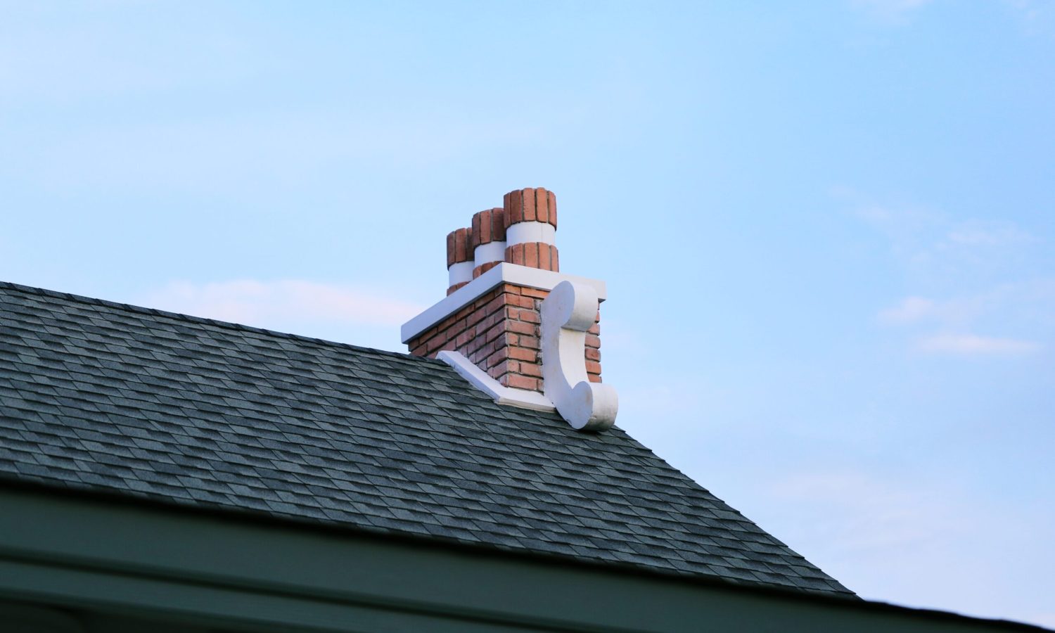 chimney-on-house-roof-closeup-blue-sky-background-2023-11-27-05-07-13-utc (2)