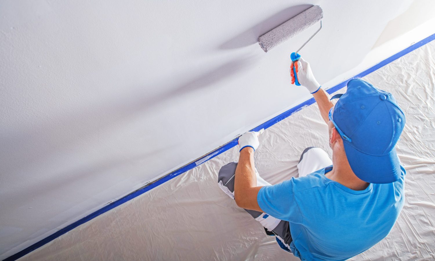 Apartment Remodeling and Painting by Caucasian Construction Worker.